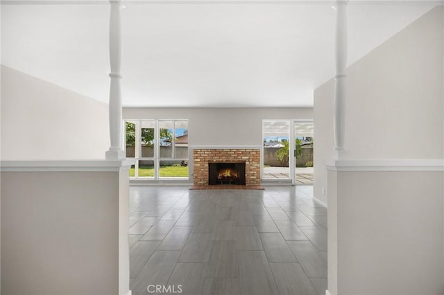 226 Breting Way, Placentia, CA 92870 - unfurnished living room featuring ornate columns and a fireplace