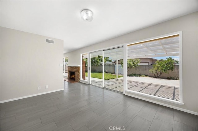 226 Breting Way, Placentia, CA 92870 - unfurnished room featuring baseboards and a brick fireplace
