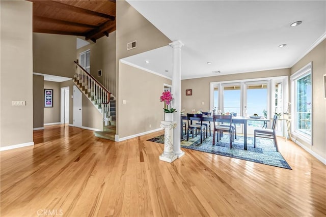 1512 Camino Lindo, South Pasadena, CA 91030 - dining room with ornate columns, baseboards, light wood-style flooring, stairway, and wooden ceiling with exposed beams