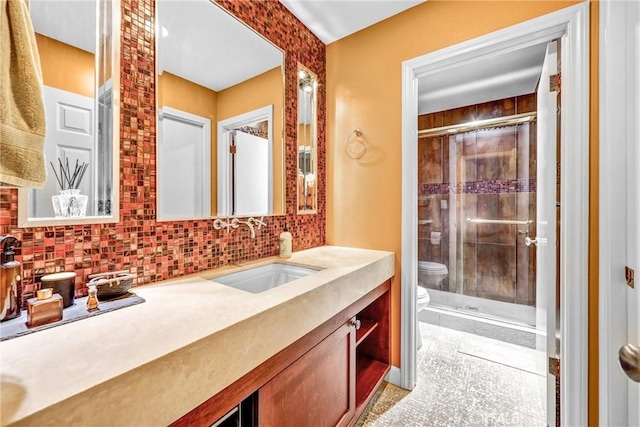1512 Camino Lindo, South Pasadena, CA 91030 - bathroom featuring toilet, vanity, a shower stall, and tasteful backsplash