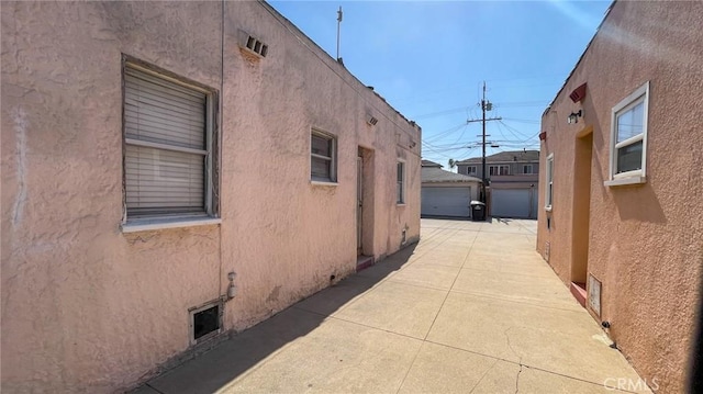 8933 Bowman Ave, South Gate, CA 90280 - view of property exterior with stucco siding and an outbuilding