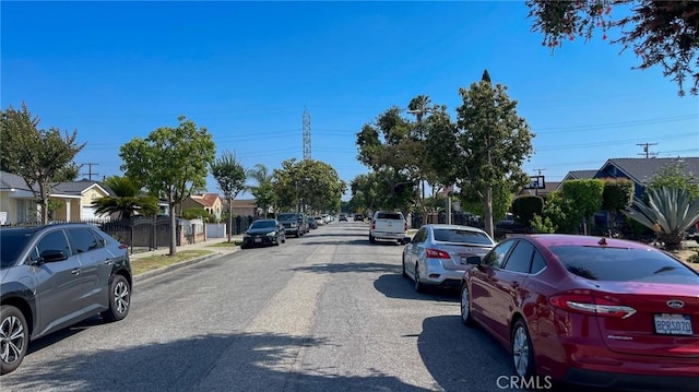 8933 Bowman Ave, South Gate, CA 90280 - view of asphalt street featuring sidewalks, curbs, and a residential view