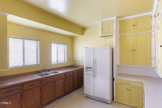 4214 Griffin Ave, Los Angeles, CA 90031 - kitchen featuring white fridge with ice dispenser, a sink, and light flooring