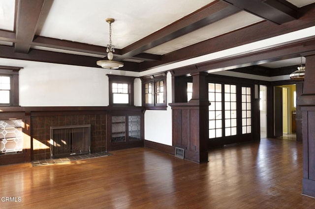 4214 Griffin Ave, Los Angeles, CA 90031 - unfurnished living room featuring a tile fireplace, beamed ceiling, wood finished floors, healthy amount of natural light, and coffered ceiling