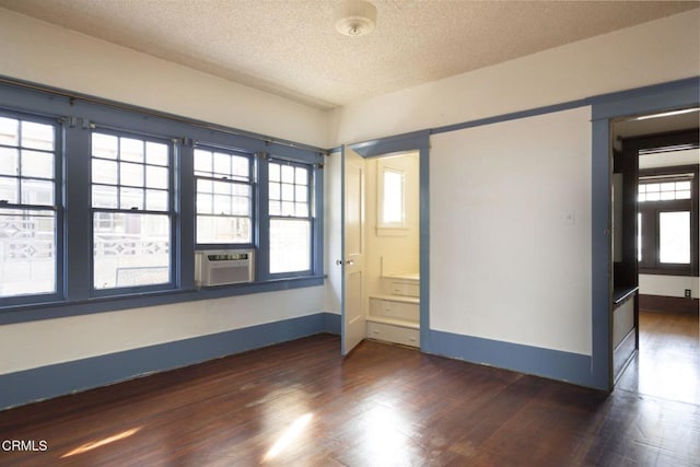 4214 Griffin Ave, Los Angeles, CA 90031 - unfurnished room with dark wood-type flooring, cooling unit, a textured ceiling, and baseboards