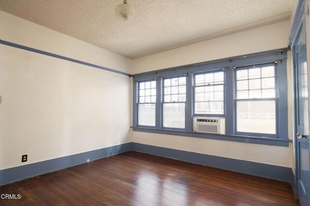 4214 Griffin Ave, Los Angeles, CA 90031 - spare room featuring wood finished floors, cooling unit, baseboards, and a textured ceiling