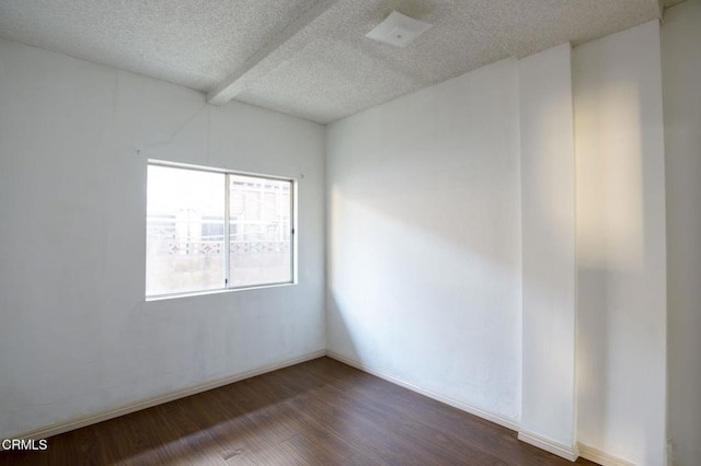 4214 Griffin Ave, Los Angeles, CA 90031 - empty room with dark wood-style floors, a textured ceiling, and baseboards