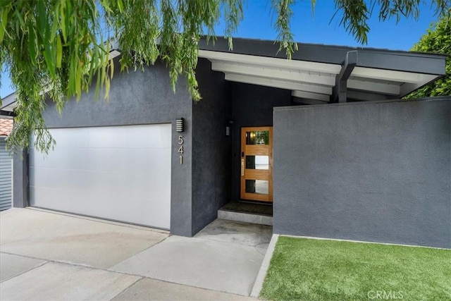 541 1st St, Manhattan Beach, CA 90266 - view of front of house with driveway and stucco siding