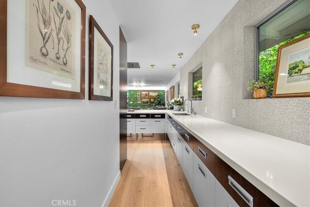 541 1st St, Manhattan Beach, CA 90266 - corridor with a sink and light wood finished floors