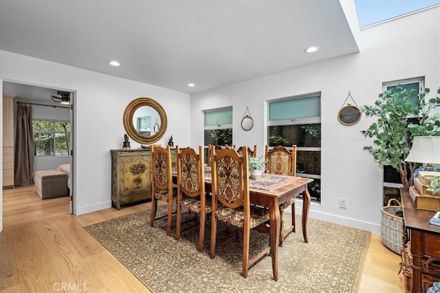 541 1st St, Manhattan Beach, CA 90266 - dining area with a skylight, light wood-style floors, recessed lighting, and baseboards