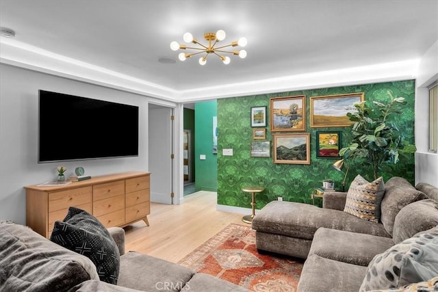 541 1st St, Manhattan Beach, CA 90266 - living room with light wood-style floors, a chandelier, baseboards, and wallpapered walls