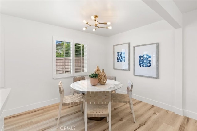 3145 Sicily Ave, Costa Mesa, CA 92626 - dining space with a chandelier, baseboards, and light wood-style floors