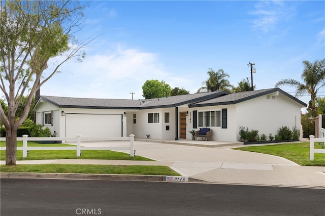3145 Sicily Ave, Costa Mesa, CA 92626 - single story home featuring a garage, driveway, and stucco siding