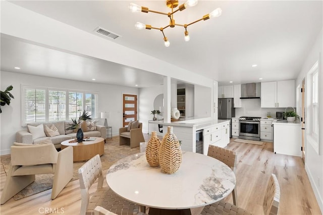 3145 Sicily Ave, Costa Mesa, CA 92626 - dining space with wine cooler, recessed lighting, light wood-style flooring, a chandelier, and baseboards