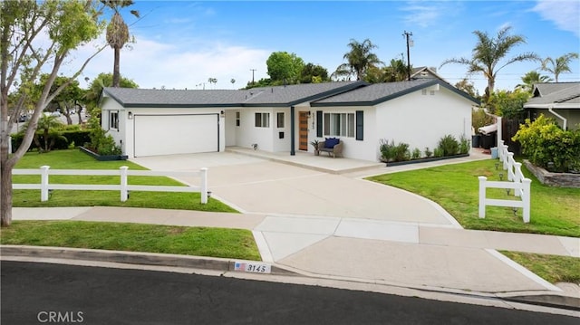 3145 Sicily Ave, Costa Mesa, CA 92626 - ranch-style home with concrete driveway, an attached garage, and stucco siding