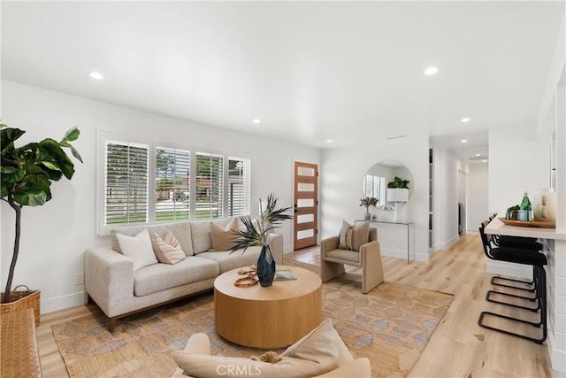 3145 Sicily Ave, Costa Mesa, CA 92626 - living room featuring light wood finished floors, recessed lighting, and baseboards