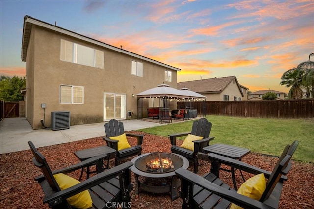 29304 Riptide Dr, Menifee, CA 92585 - back of house with an outdoor fire pit, a gazebo, a patio, central AC unit, and stucco siding
