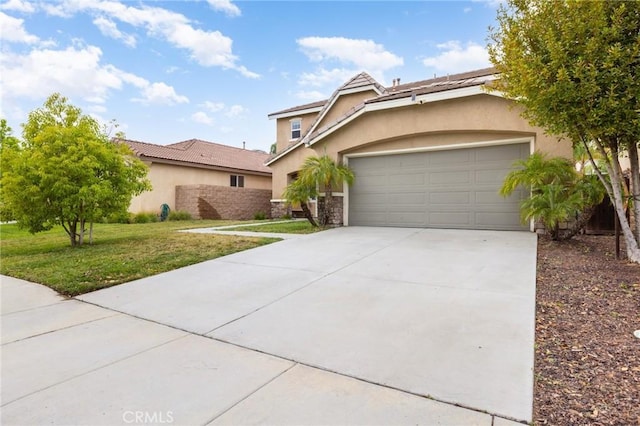 29304 Riptide Dr, Menifee, CA 92585 - view of front of house featuring stucco siding, concrete driveway, an attached garage, a front yard, and stone siding