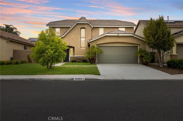 29304 Riptide Dr, Menifee, CA 92585 - traditional-style house with an attached garage, driveway, stucco siding, a lawn, and stone siding