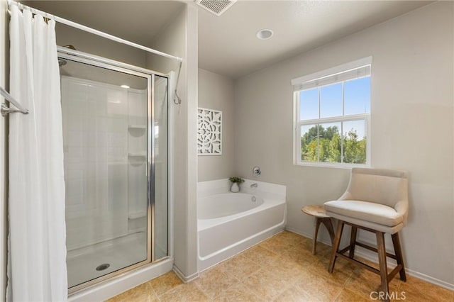 29304 Riptide Dr, Menifee, CA 92585 - full bath featuring a shower stall, a bath, and baseboards