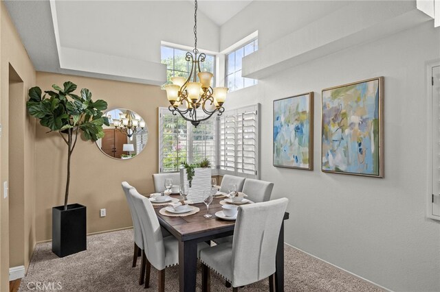 14252 Parkside Ct, Chino Hills, CA 91709 - carpeted dining space featuring a chandelier and baseboards