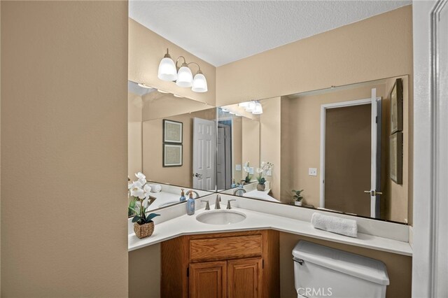 14252 Parkside Ct, Chino Hills, CA 91709 - bathroom featuring toilet, vanity, and a textured ceiling