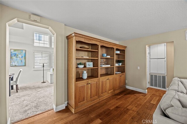 14252 Parkside Ct, Chino Hills, CA 91709 - living area featuring dark wood finished floors and baseboards