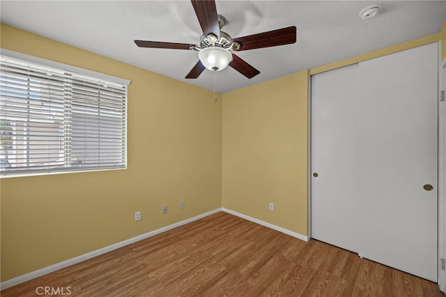 14252 Parkside Ct, Chino Hills, CA 91709 - unfurnished bedroom featuring wood finished floors, a closet, baseboards, and a ceiling fan
