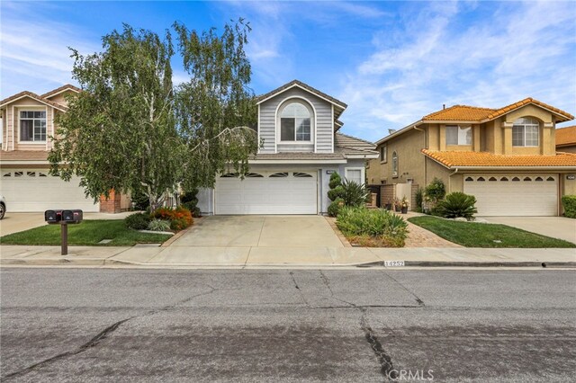 14252 Parkside Ct, Chino Hills, CA 91709 - traditional home with an attached garage, concrete driveway, and stucco siding