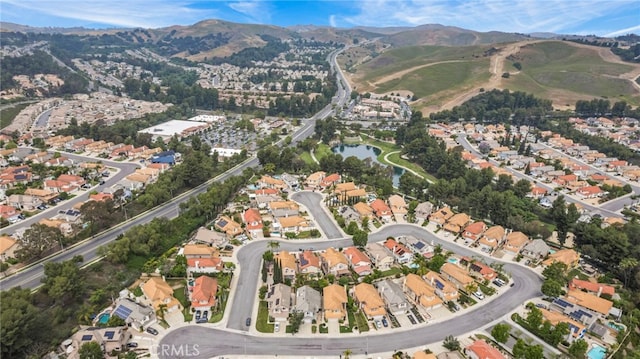 14252 Parkside Ct, Chino Hills, CA 91709 - aerial overview of property's location featuring a mountainous background and nearby suburban area