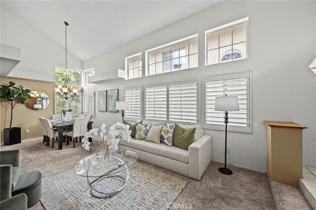 14252 Parkside Ct, Chino Hills, CA 91709 - carpeted living area with high vaulted ceiling, a chandelier, and baseboards