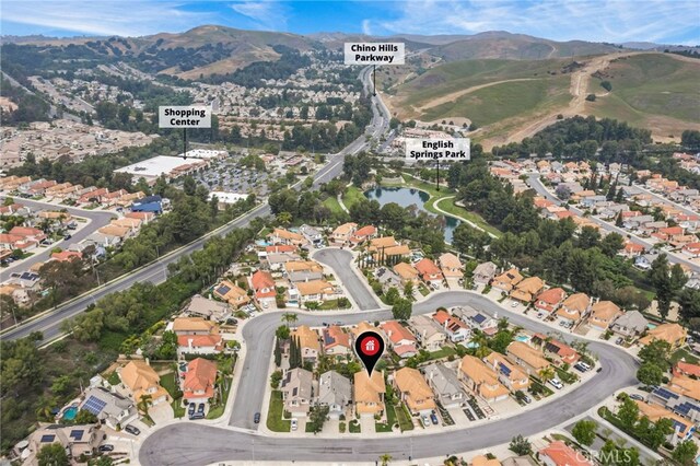14252 Parkside Ct, Chino Hills, CA 91709 - aerial overview of property's location featuring nearby suburban area and a water and mountain view