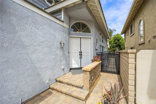 14252 Parkside Ct, Chino Hills, CA 91709 - view of exterior entry with stucco siding and a gate