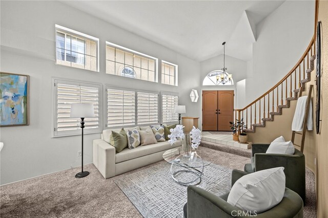 14252 Parkside Ct, Chino Hills, CA 91709 - carpeted living area with high vaulted ceiling, a chandelier, and stairway
