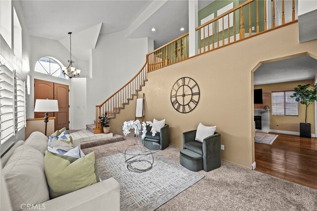 14252 Parkside Ct, Chino Hills, CA 91709 - living room with healthy amount of natural light, high vaulted ceiling, stairway, carpet, and a chandelier