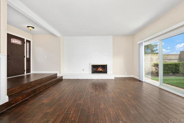 6 Cape Cod, Irvine, CA 92620 - unfurnished living room with dark wood-style flooring and a fireplace