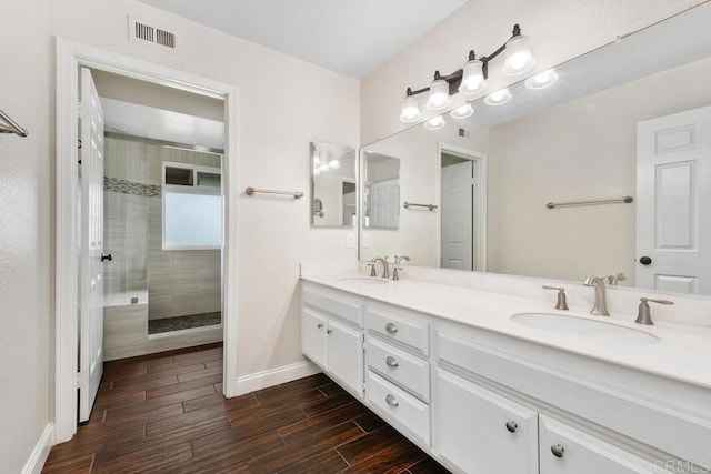 6 Cape Cod, Irvine, CA 92620 - bathroom with double vanity, walk in shower, and wood finished floors