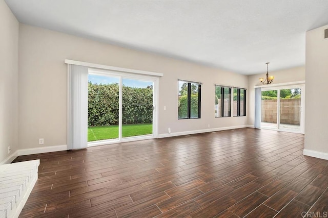 6 Cape Cod, Irvine, CA 92620 - unfurnished living room with a chandelier and dark wood-style floors
