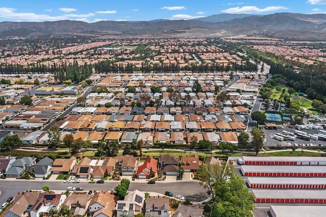 6 Cape Cod, Irvine, CA 92620 - aerial view of property's location featuring a mountain backdrop and nearby suburban area