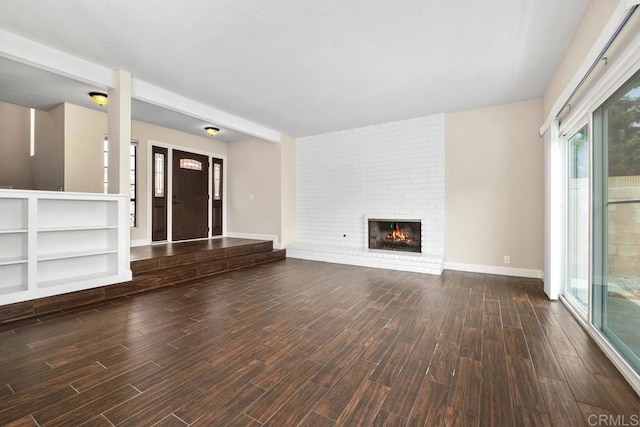 6 Cape Cod, Irvine, CA 92620 - unfurnished living room with wood finished floors and a brick fireplace