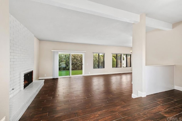 6 Cape Cod, Irvine, CA 92620 - unfurnished living room featuring wood finished floors and a brick fireplace