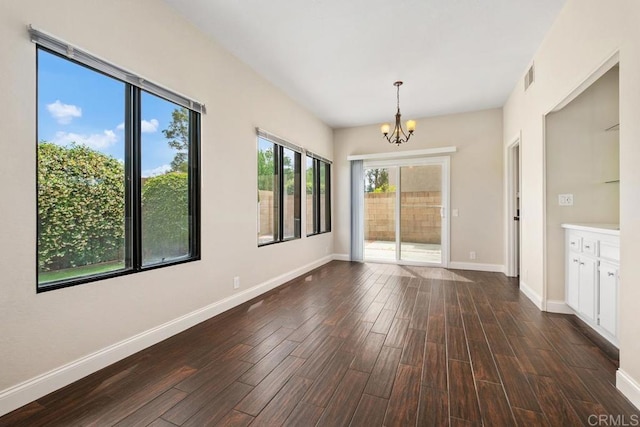6 Cape Cod, Irvine, CA 92620 - unfurnished dining area featuring a chandelier and dark wood-style flooring