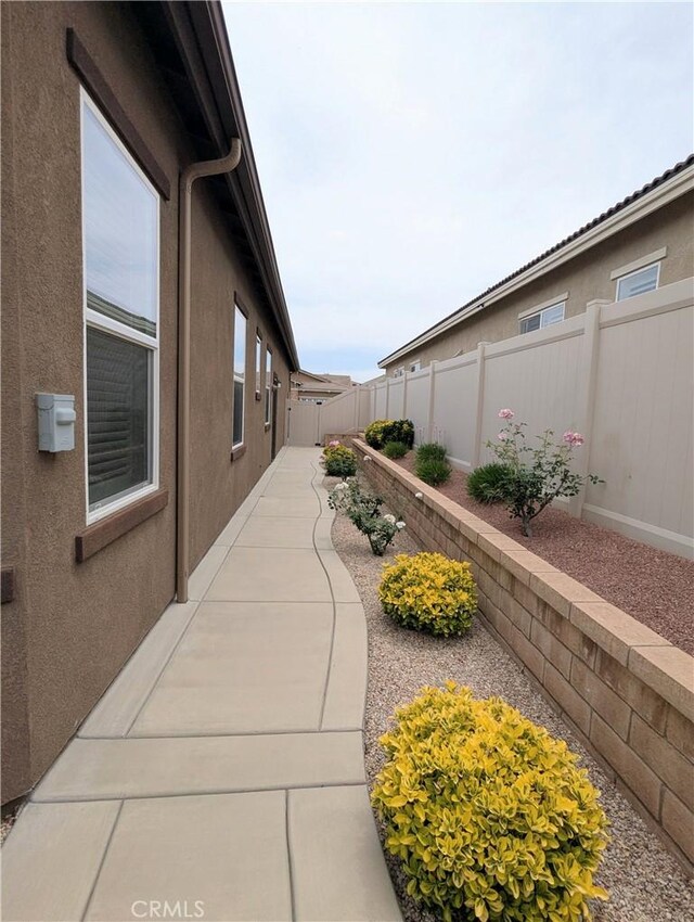 1582 Timberline, Beaumont, CA 92223 - view of home's exterior featuring a fenced backyard, a patio, and stucco siding