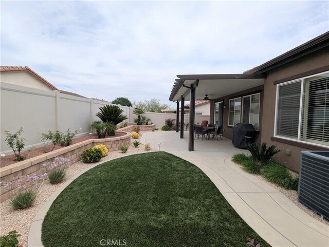 1582 Timberline, Beaumont, CA 92223 - fenced backyard featuring a ceiling fan and a patio