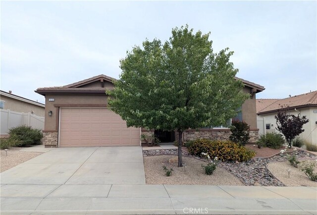 1582 Timberline, Beaumont, CA 92223 - view of property hidden behind natural elements with driveway, stucco siding, stone siding, and a garage