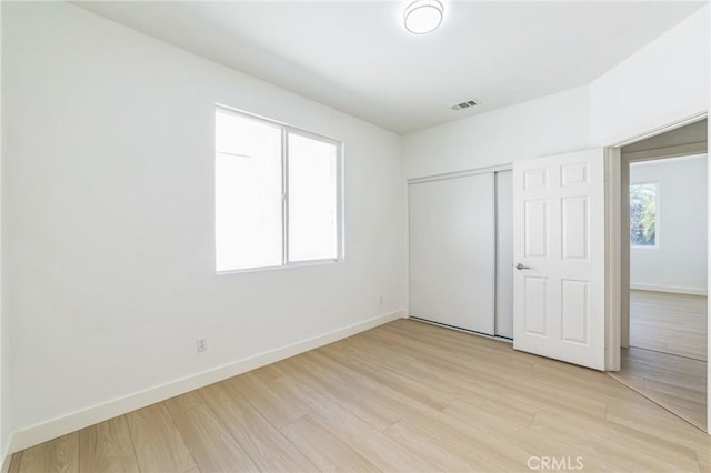 1172 Cedar Hollow Rd, Beaumont, CA 92223 - unfurnished bedroom featuring light wood-type flooring and a closet