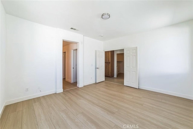 1172 Cedar Hollow Rd, Beaumont, CA 92223 - unfurnished bedroom featuring light wood-style floors and baseboards
