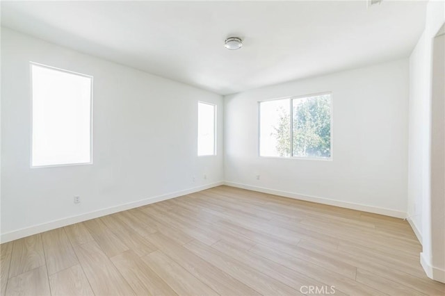1172 Cedar Hollow Rd, Beaumont, CA 92223 - empty room featuring plenty of natural light and light wood-style floors