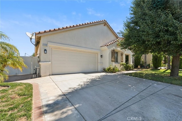 1172 Cedar Hollow Rd, Beaumont, CA 92223 - view of front of property with driveway, stucco siding, a garage, and a tile roof