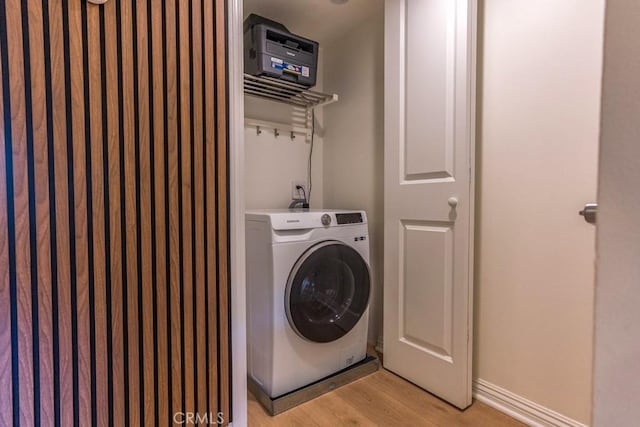 18350 Hatteras St Unit 169, Tarzana, CA 91356 - laundry area featuring washer / dryer and light wood-style flooring